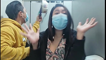 Filipino woman engages in public sexual activity in a restroom